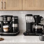 A side-by-side comparison of Ninja Luxe Café espresso machine and Moccamaster with a glowing WiFi smart plug in a modern kitchen.