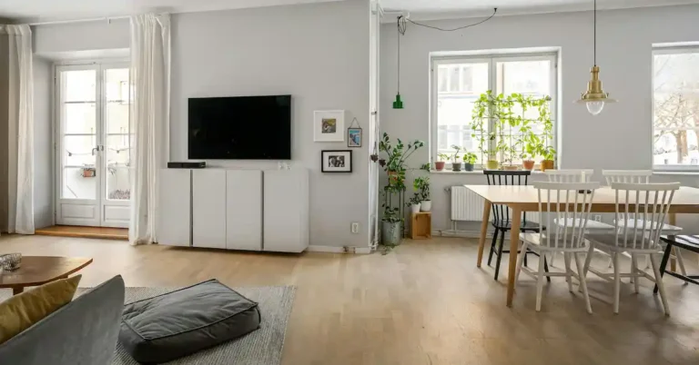 Modern open floor living room featuring ecosystem Smart Home Hubs and connected devices.
