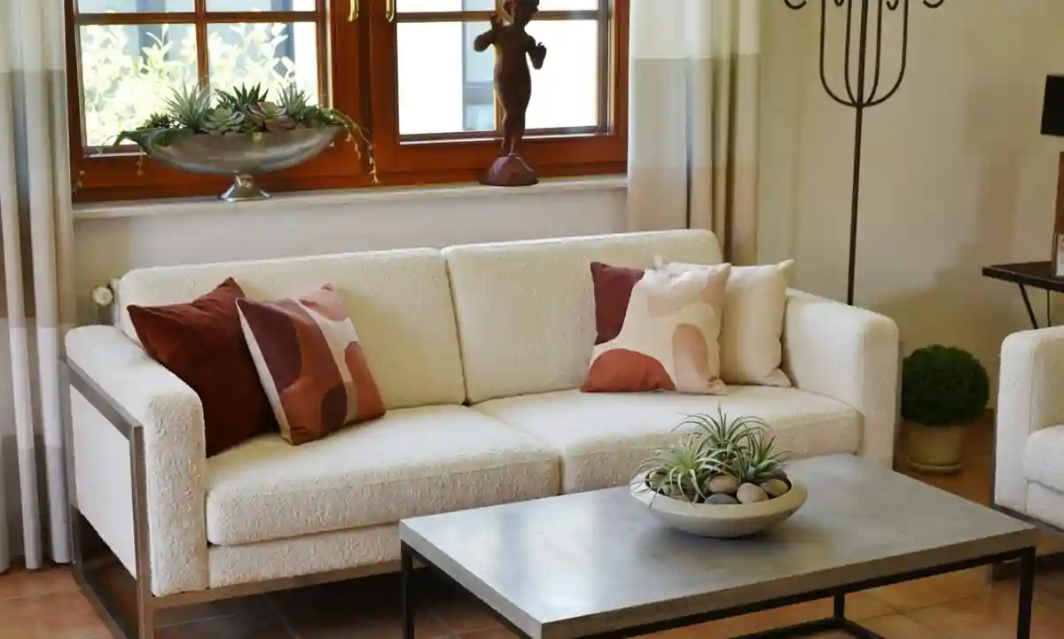 Strategic **space optimization** in a modern living room, replacing bulky traditional furniture with sleek minimalist 2026 designs while maintaining room authenticity.