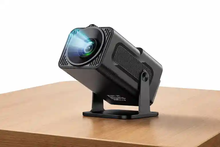 Sleek black smart projector on a wooden table, the perfect device to enjoy-world-cup-2026 with high brightness.