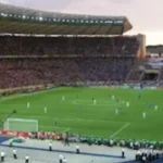A crowded football stadium background for users looking to enjoy World Cup 2026 live matches.
