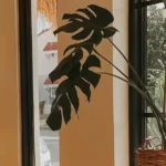 Indoor plant near sunlight window in compact space promoting skincare and wellness.