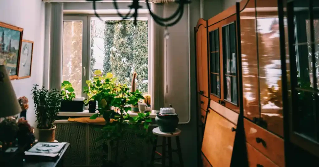 A sealed window in a compact apartment illustrating why best smart ventilation for small spaces in winter is needed to prevent health risks