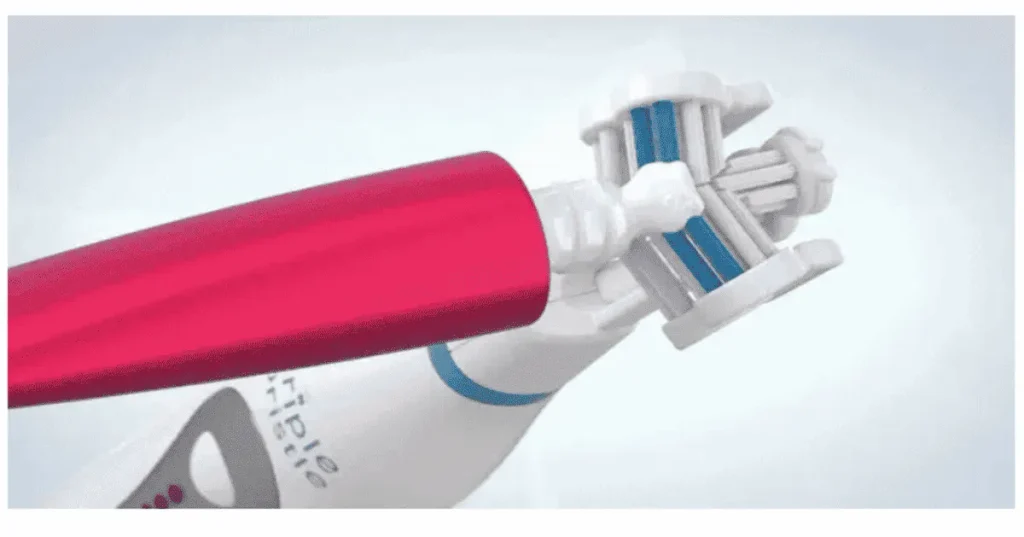 Close-up view of the Triple Bristle Max Sonic Toothbrush 3-sided brush head showing angled bristles